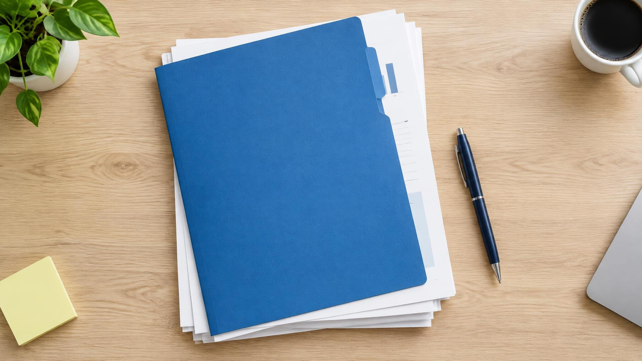 Stack of documents with a pen and folder