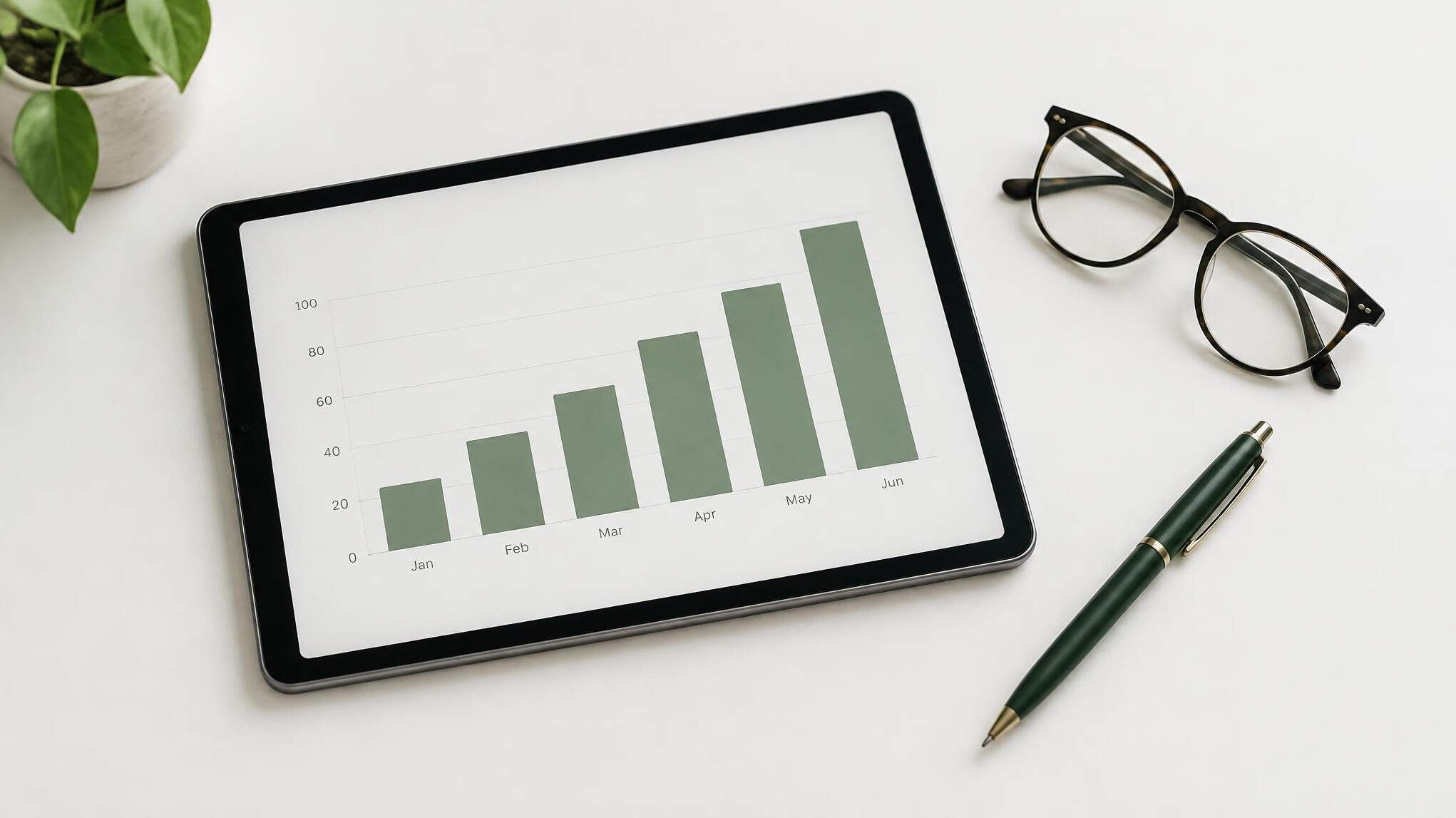 Tablet with a bar chart on a white table